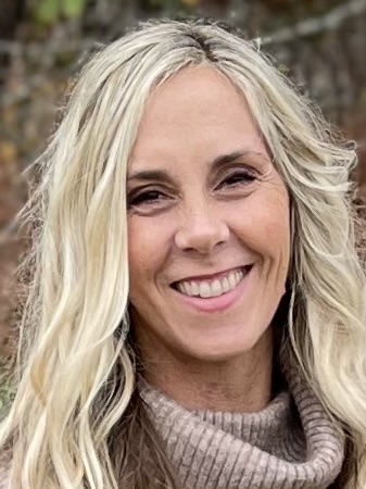 a woman smiling for the camera